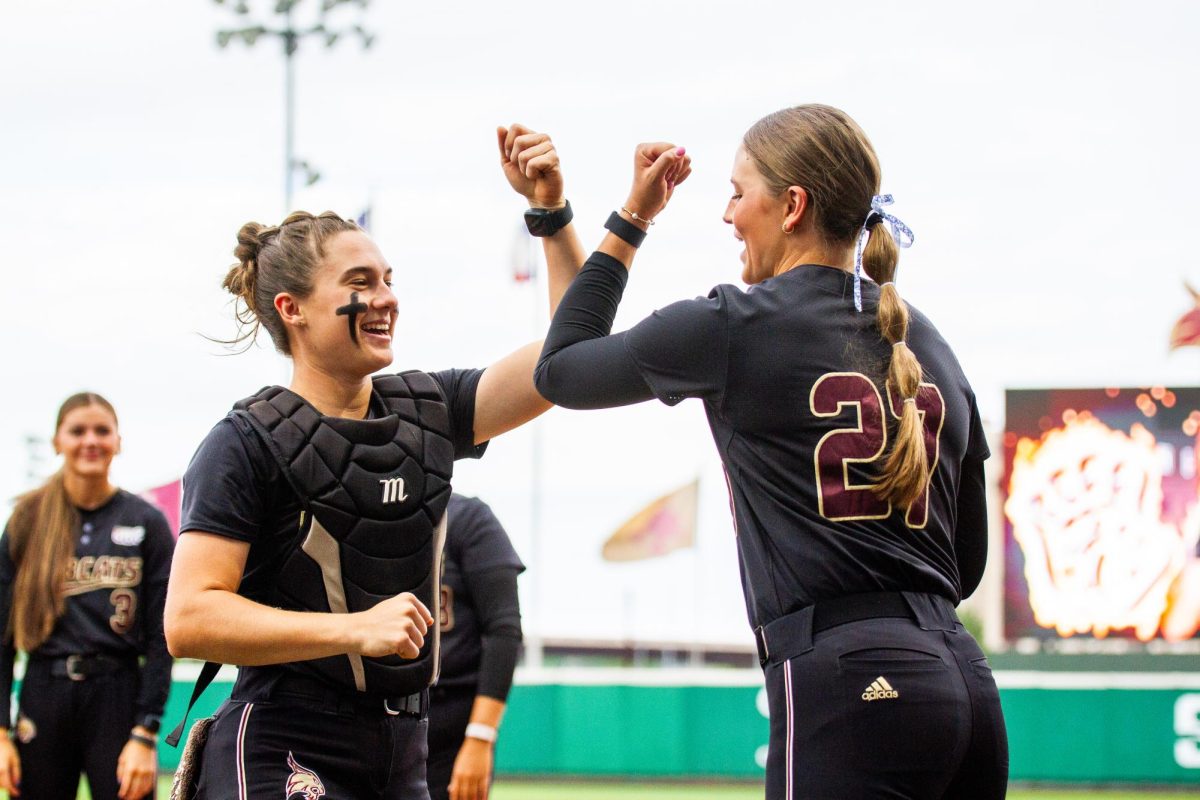 Texas State senior catcher Megan Kelner (left) and redshirt sophomore pitcher Abigail Jennings (right) dance pregame, Tuesday, April 7, 2026, at Bobcat Softball Field. The Bobcats beat the UTSA Roadrunners 3-0 to win the I-35 rivalry.