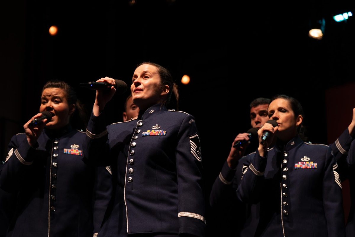 Master Sergeant Adrienne Kling (center) sings a solo with the Singing Sergeants and the Air Force Concert Band in Evans Auditorium in the Evans Liberal Arts Building, Monday, March 30, 2026, at Texas State.