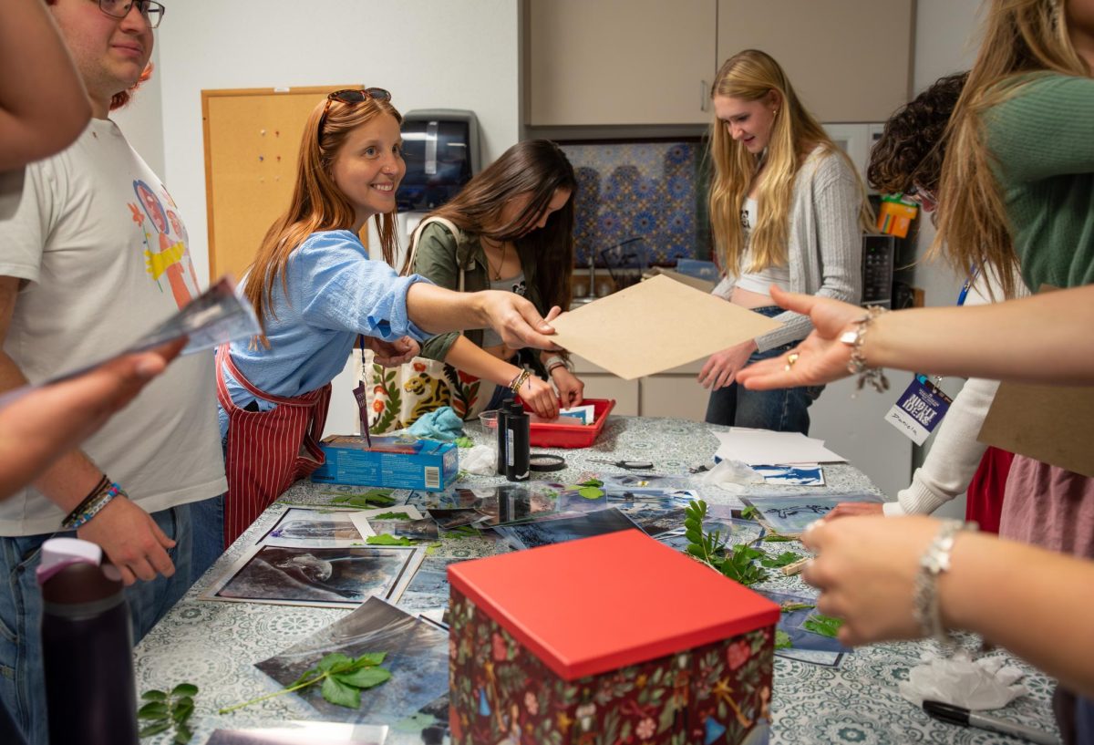Photographer and the founder of local photography club San Marcos Photo Friends Meggie Emerick teaches participants about cyanotypes Friday, March 27 2026 at the Taylor Murphy building.