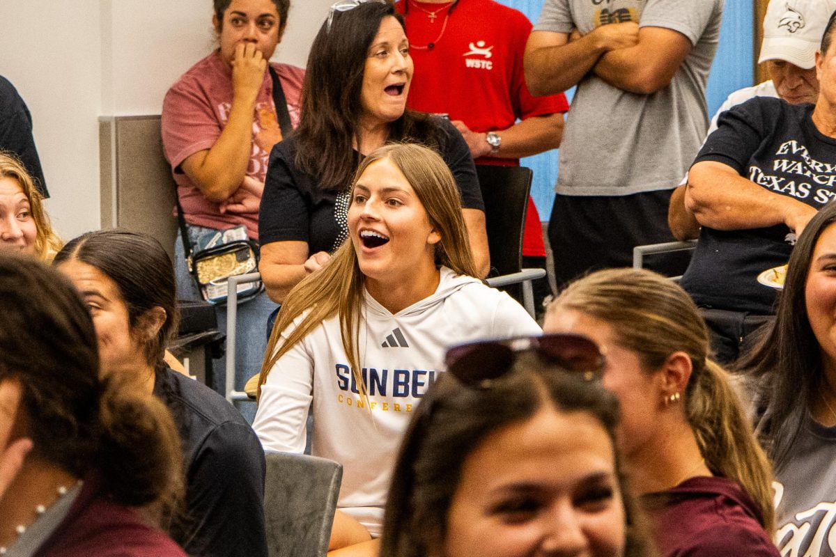 Texas State redshirt sophomore pitcher Abigail Jennings smiles as she watches the NCAA Softball selection show, May 10, 2026, at Castro Club at Strahan Arena. The Bobcats are headed to Gainesville, Florida to play in the regional games.