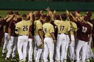 The Texas State baseball team gives the "States Up" hand sign in a huddle after their victory against Stephen F. Austin, Wednesday, April 8, 2026, at Irvine-Rasmussen Ballpark. The Bobcats won 10-0.