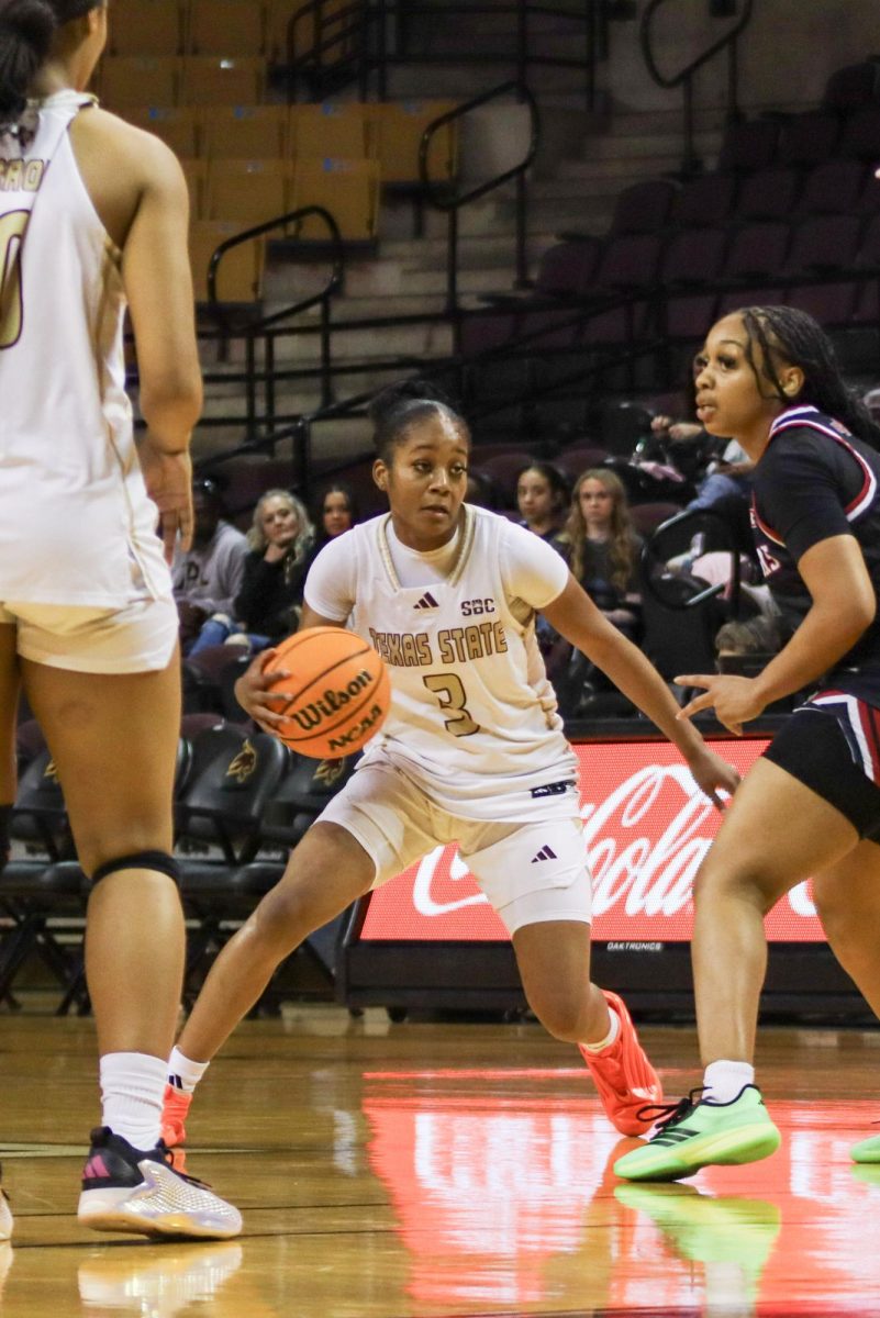 Texas State sophomore guard Saniya Burks (3) drives the ball to the basket, Wednesday, Feb. 18, 2026, at Strahan Arena. The Bobcats lost 75-61 against Arkansas State.