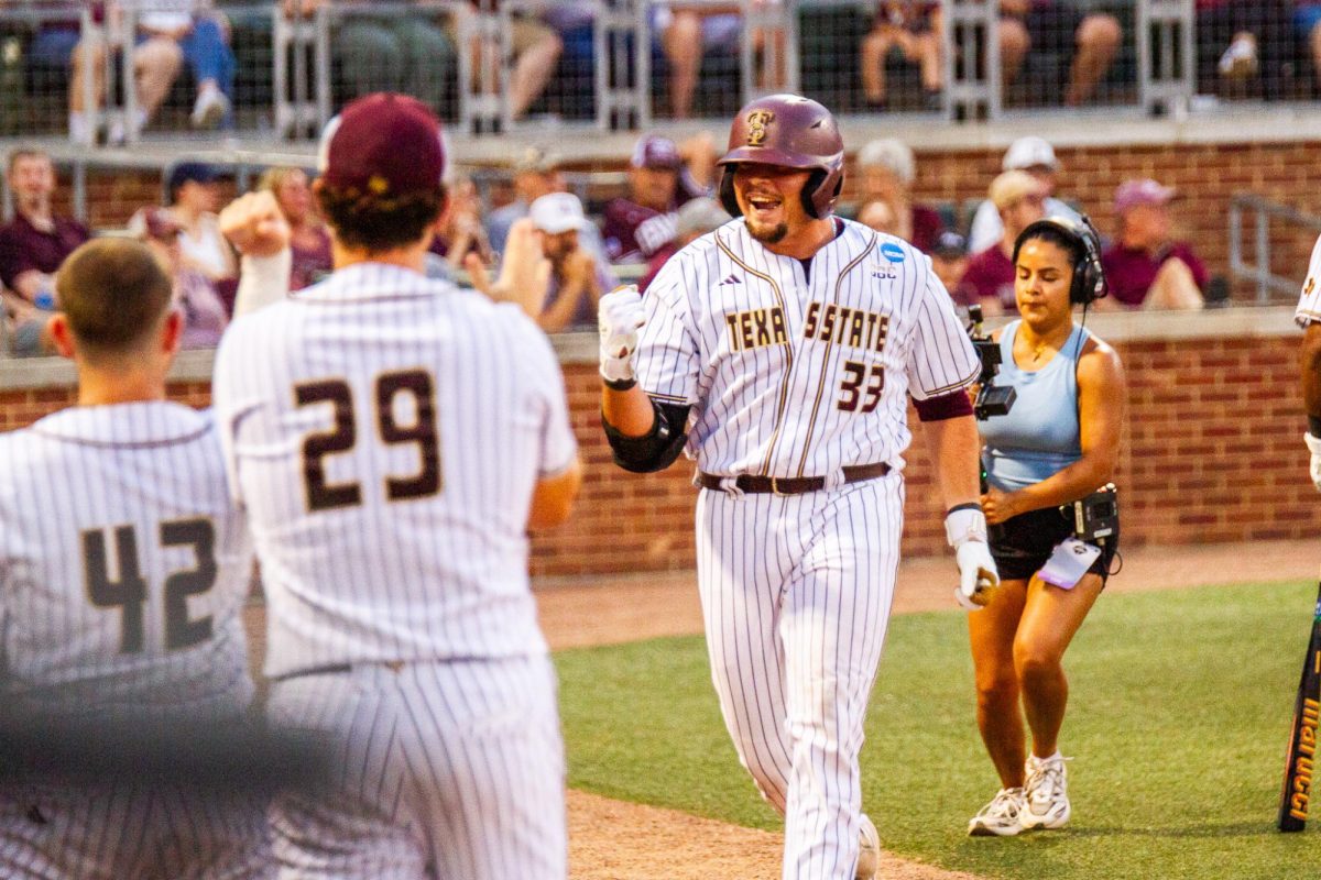 Texas State junior designated hitter Manny Salas (33) celebrates at the College Station Regional Playoff, May 30, 2026, at Blue Bell Park in College Station, Texas. The Bobcats lost to the Texas A&M Aggies 17-2.