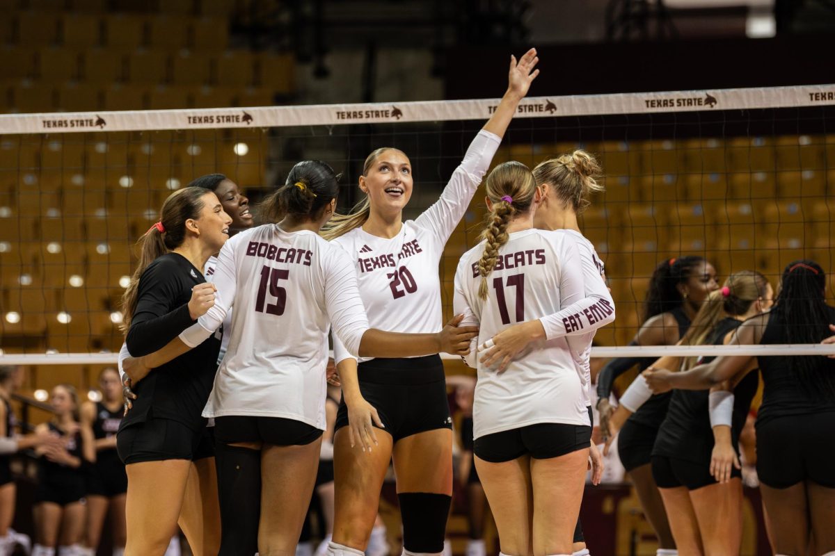 Texas State volleyball celebrates after a point is scored, Saturday, Sept. 27, 2025, at Strahan Arena. Texas State won 3-0 against Louisiana Ragin' Cajuns.