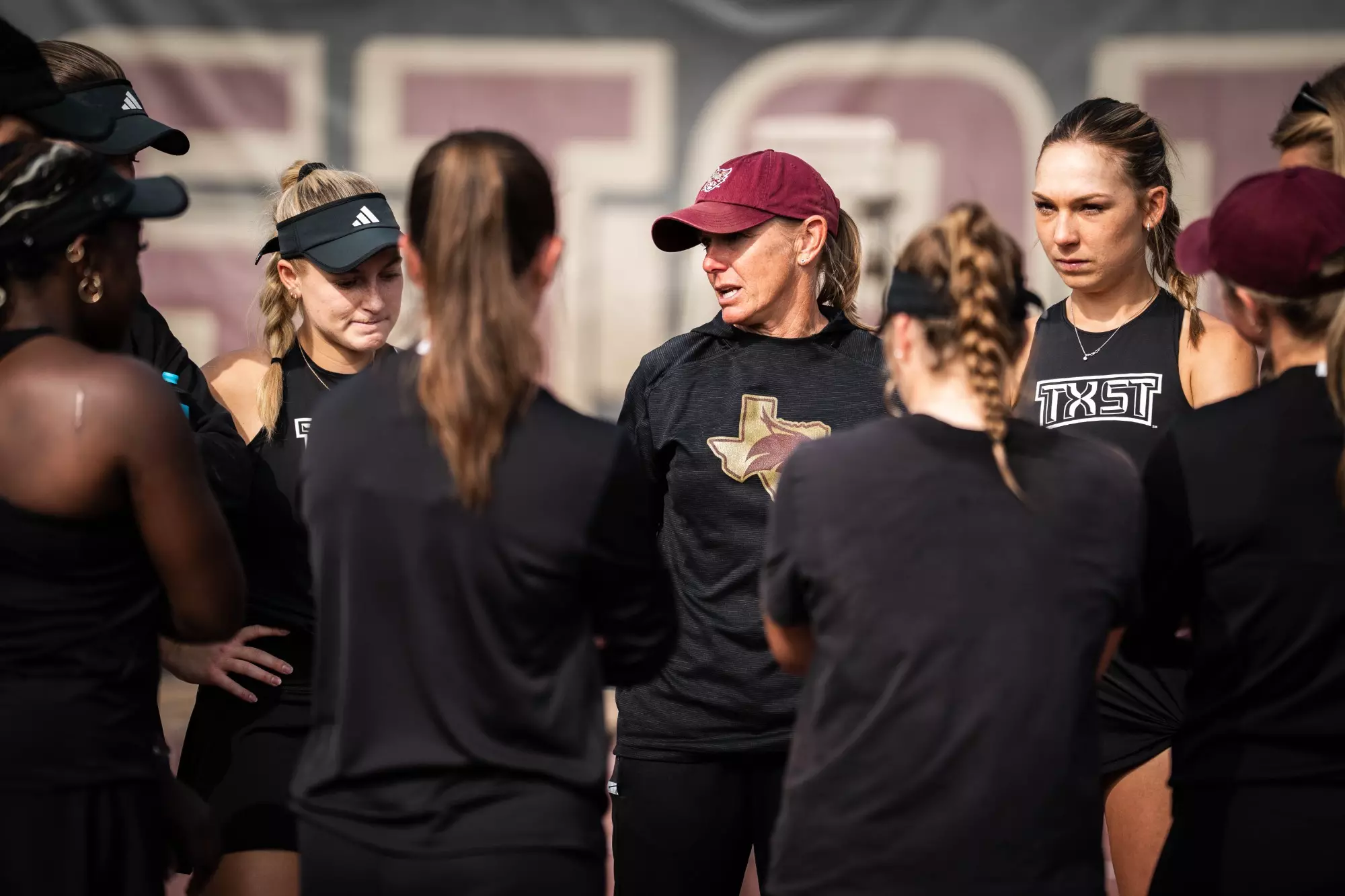 Texas State tennis huddles prior to game against Incarnate Word at Bobcats Tennis Complex.